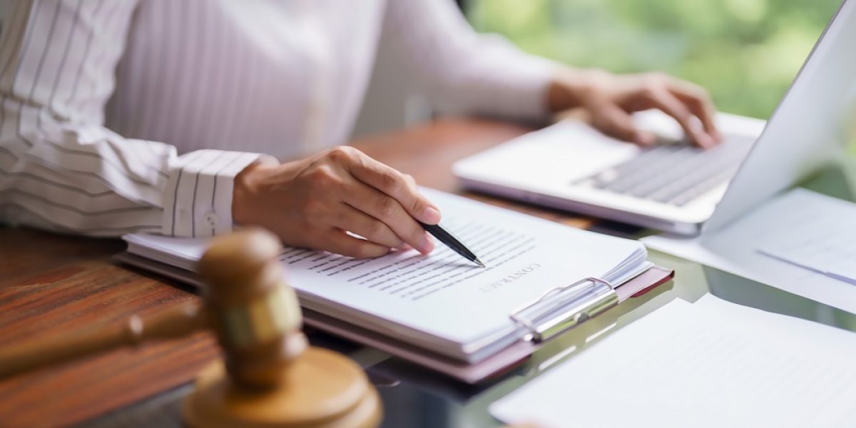 Lawyer woman reading and checking legal agreement