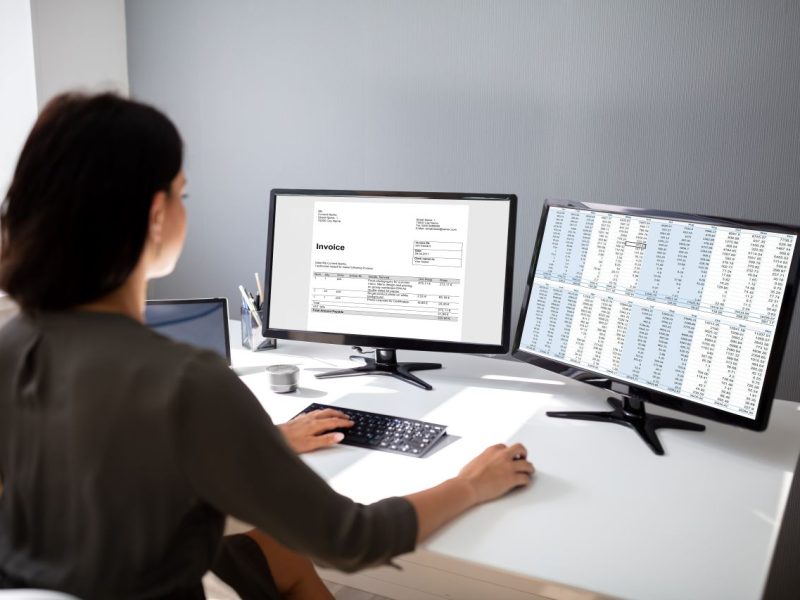 Female accountant prepares invoice for tex services