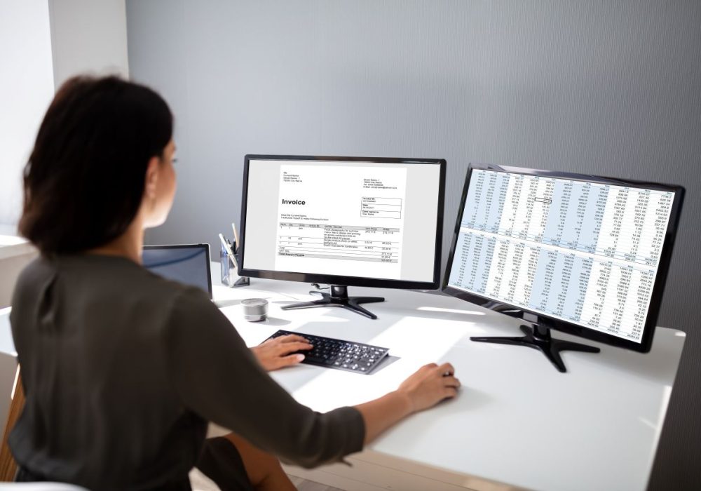 Female accountant prepares invoice for tex services