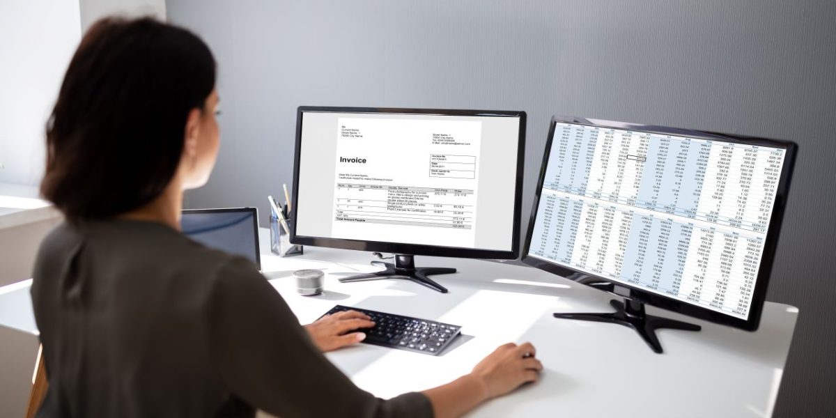 Female accountant prepares invoice for tex services